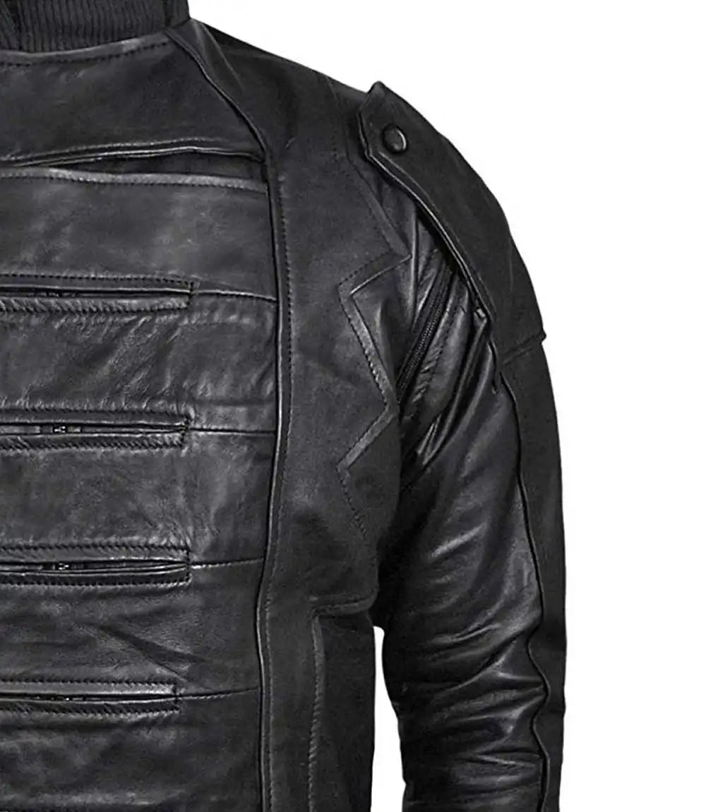 Close-up of a black leather jacket with zippers on a white background