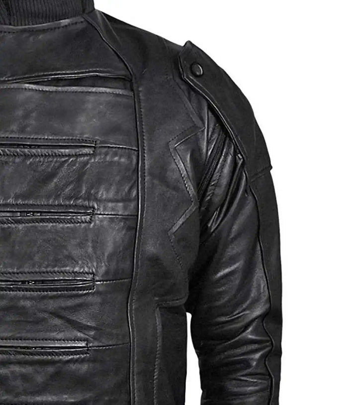 Close-up of a black leather jacket with zippers on a white background