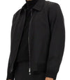 Black jacket with a zipper on a white background
