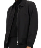 Black jacket with a zipper on a white background