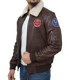 Brown leather jacket with patches on a white background