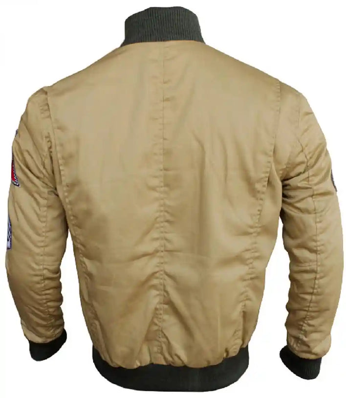 Beige bomber jacket with patches on a white background