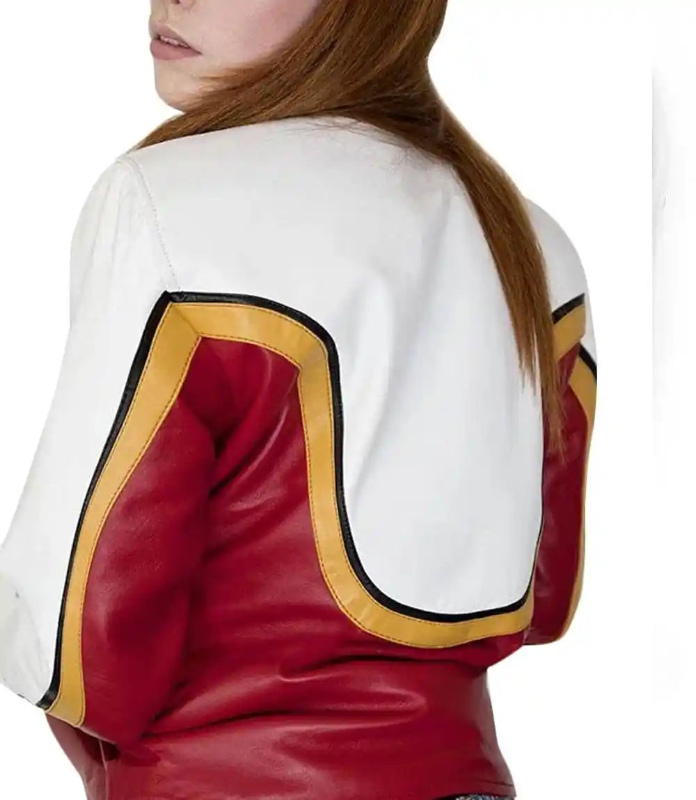 Close-up of a red and white jacket with gold accents on a plain background