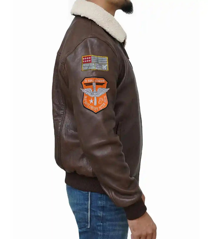 Brown leather jacket with patches on a white background