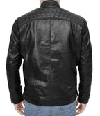 Black leather jacket worn by a person on a white background