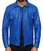 Blue leather jacket worn by a person on a white background