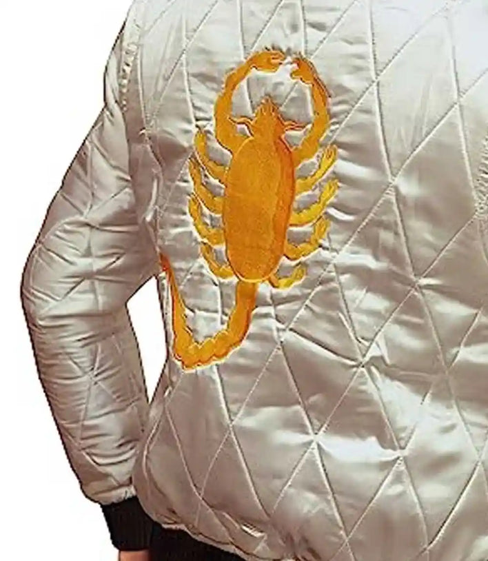 White quilted jacket with a yellow scorpion design on a white background