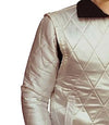 Quilted beige jacket with diamond pattern on a white background