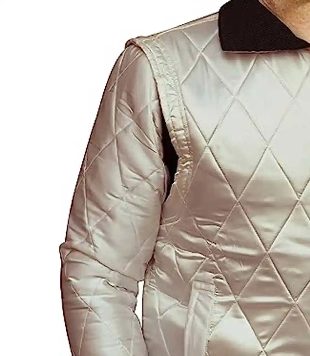 Quilted beige jacket with diamond pattern on a white background