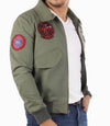 Green bomber jacket with patches on a white background