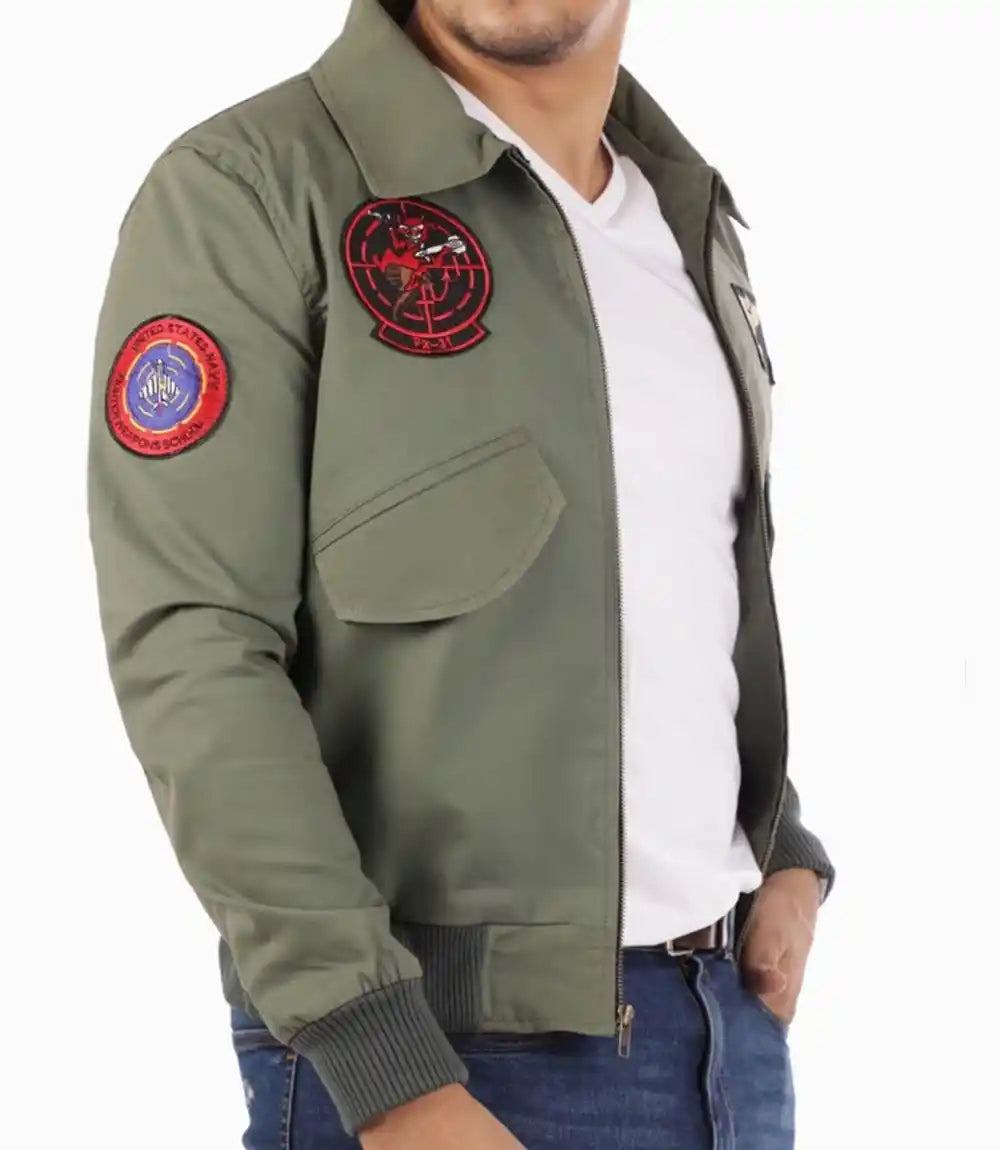Green bomber jacket with patches on a white background